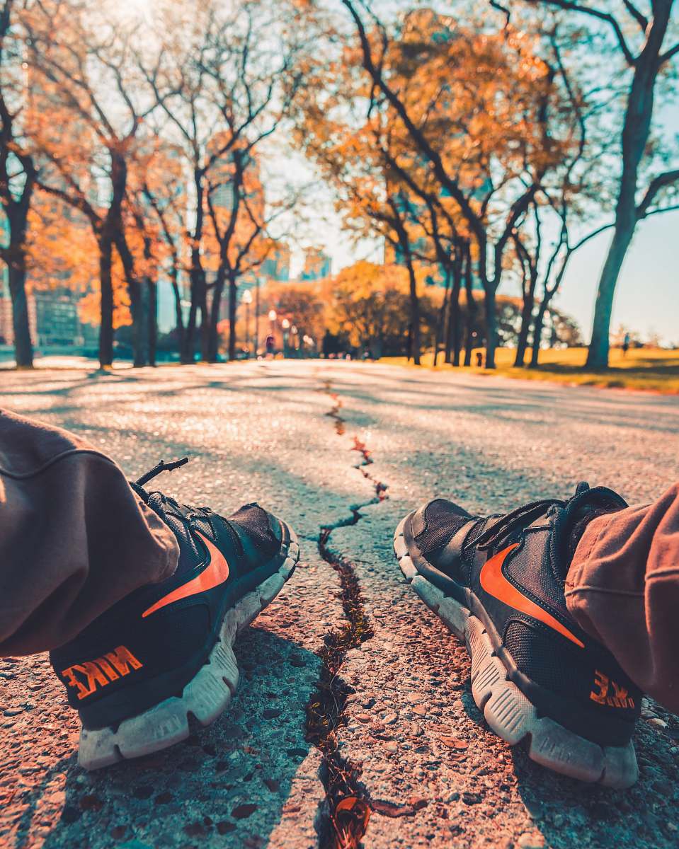 chicago person wearing Nike running shoes sitting on road outdoor boot